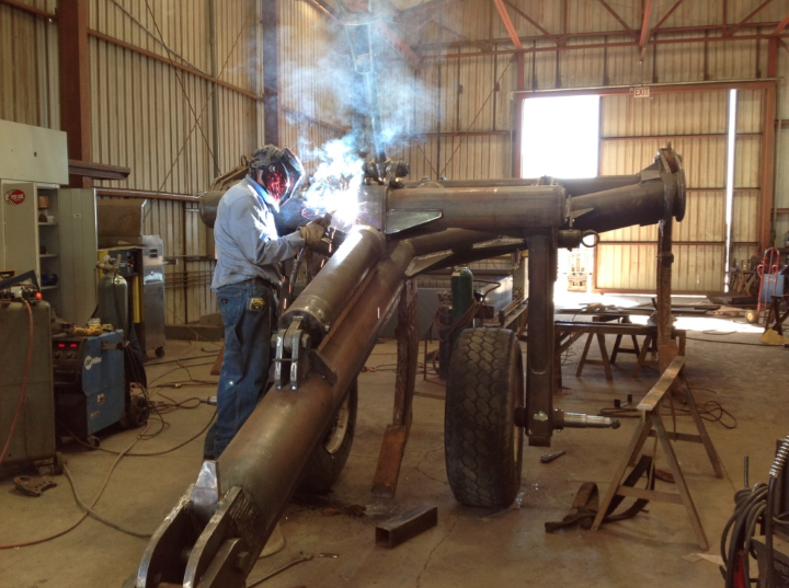Man welding big equipment